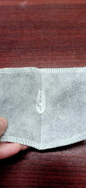 Non woven layer - water repellent,  outside of carbon filter layer 