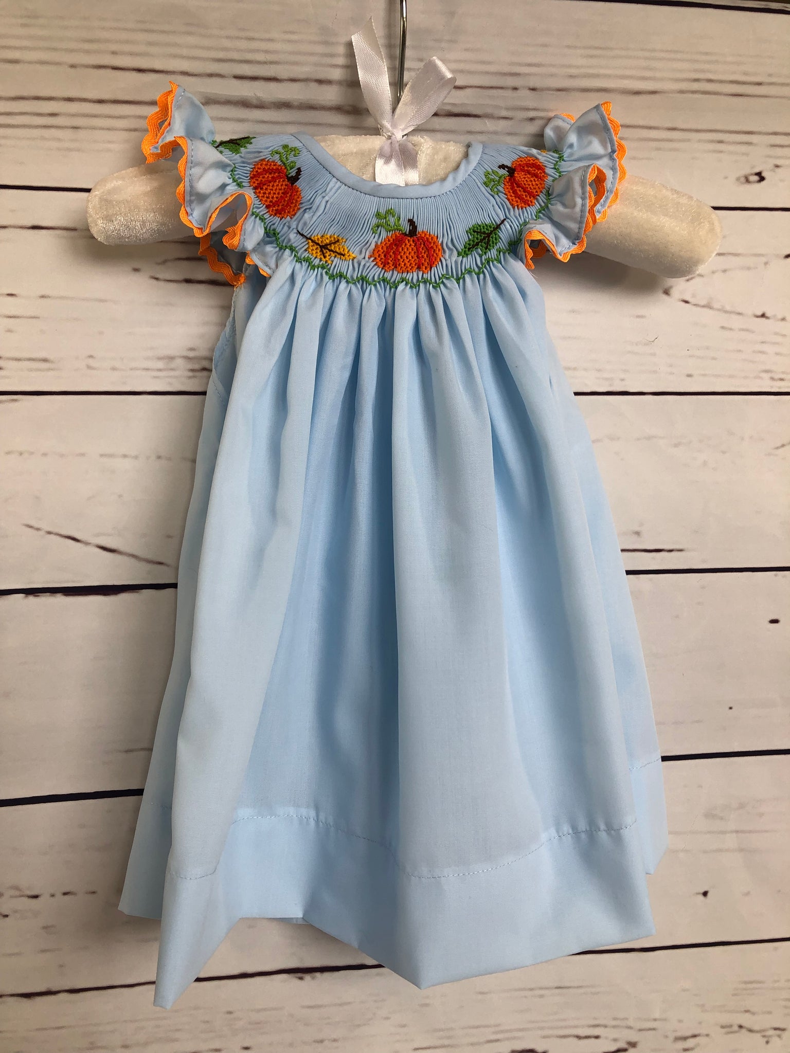 Pumpkins and leaves smocked dress Honey Bee Smocked Boutique Pumpkins and leaves smocked dress Honey Bee Smocked Boutique
