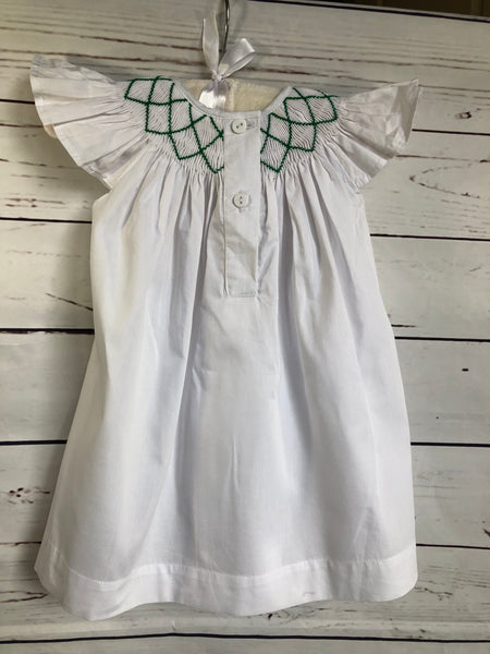 White dress with red and green smocked detail