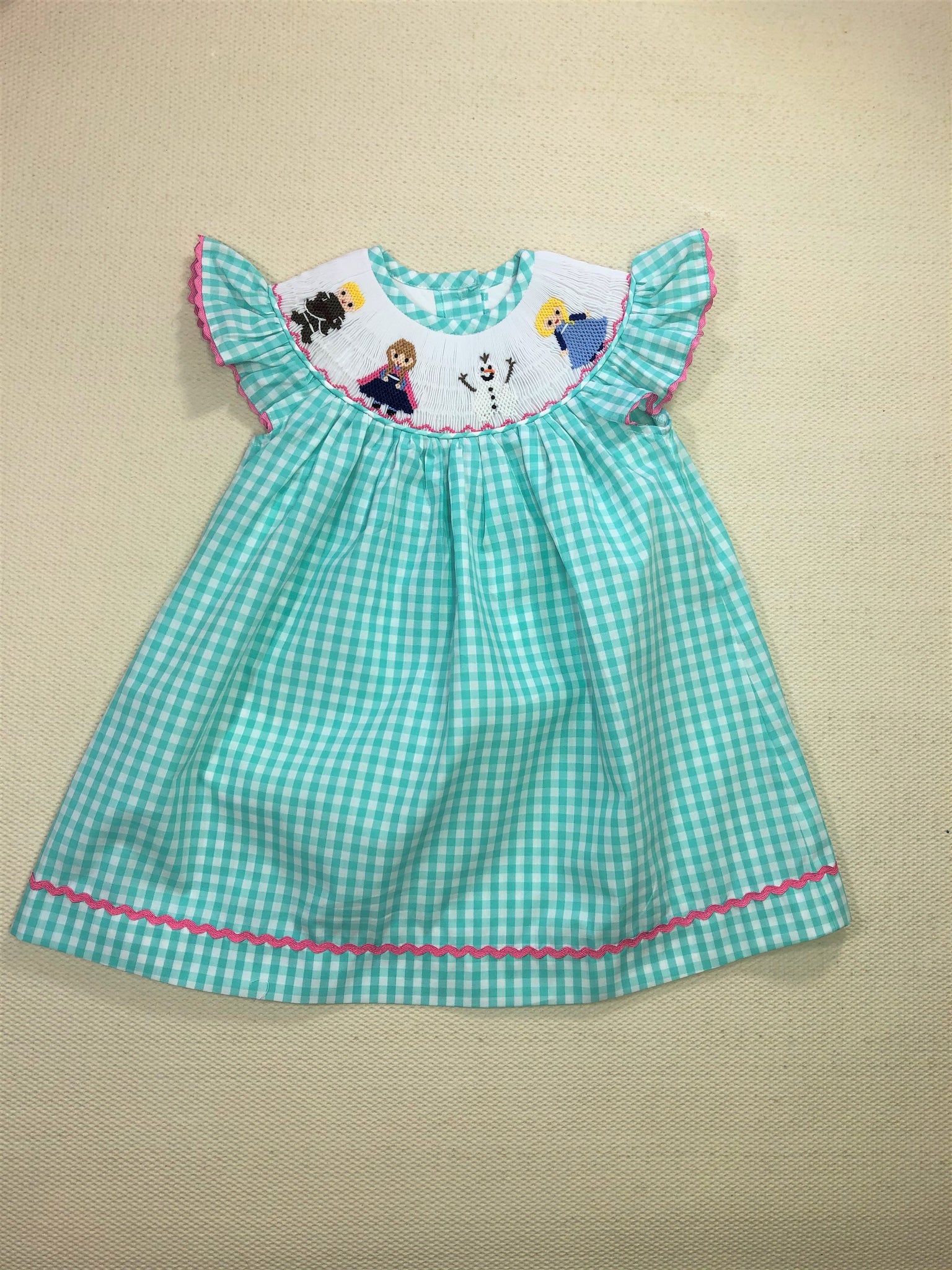 Elsa and Anna Frozen theme smocked dress Honey Bee Smocked Boutique Elsa and Anna Frozen theme smocked dress Honey Bee Smocked Boutique